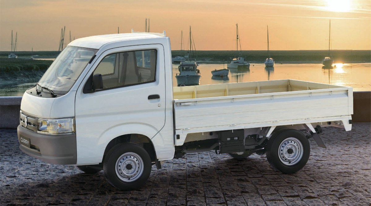 Suzuki Super Carry Pro thùng lửng màu trắng nhìn từ bên hông